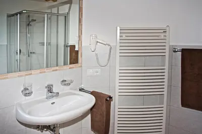 a bathroom with a sink and a shower at Solerhof in Laion