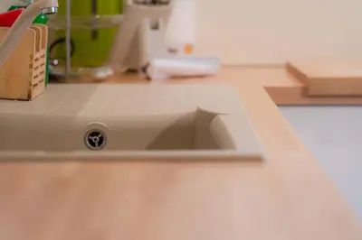 a kitchen sink with a hole in the counter at Appartamento Lucia in Penia