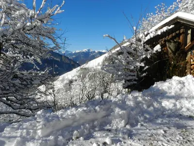 a pile of snow next to a house at Gedrarzerhof in Luson