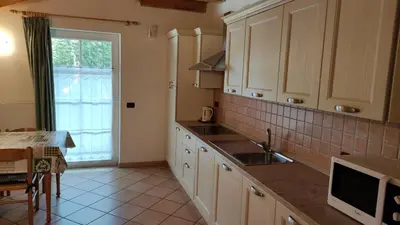 a kitchen with a sink and a counter top at Cesa Stefi in Canazei