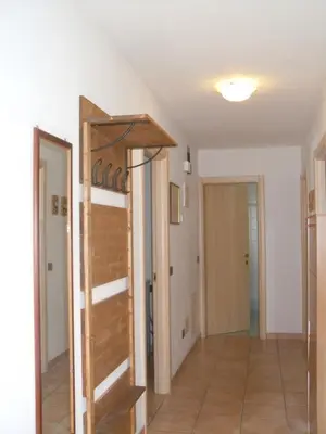 a room with a ladder in the middle of a room at Cesa Stefi in Canazei
