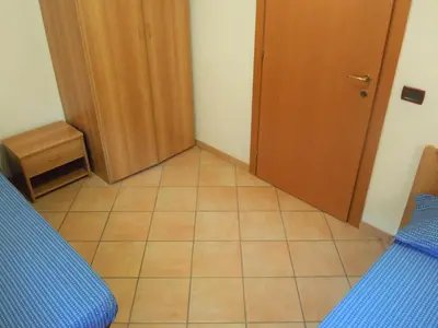 a small room with a door and a tiled floor at Cesa Stefi in Canazei