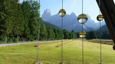 a view from a window of a field and a road at Casa Alice 5.5 in Fiera di Primiero