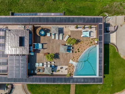 an overhead view of a building with a pool at The Lodge Sporthotel - Golfclub Eppan in Appiano sulla Strada del Vino