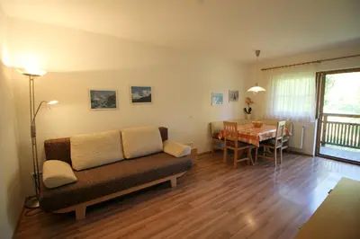 a living room with a couch and a table at Apartments Im Winkl in Brunico