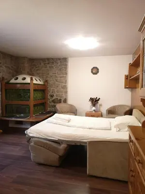 a bedroom with a large bed in a room at Sas da Rocia by go new location in Soraga