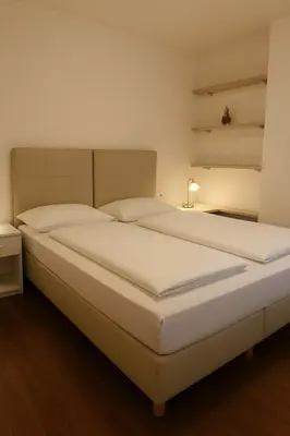 a large white bed in a room at Sas da Rocia by go new location in Soraga