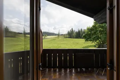 a view of a green field from a window at Hotel Oberwirt in Verano