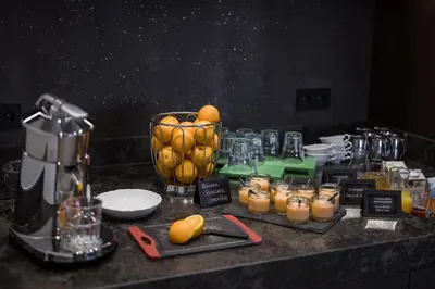 a counter with a blender and a bunch of fruit at Hotel Oberwirt in Verano