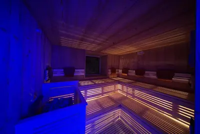 an empty room with lights on the floor at Hotel Oberwirt in Verano