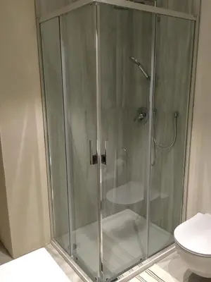 a shower with a glass door in a bathroom at Apartments Rathaus 008 - Municipio 008 in Bolzano