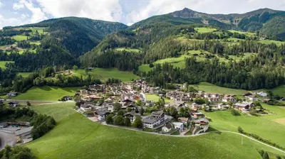 an aerial view of a small village in the mountains at Residence Karnutsch in Santa Valburga St. Walburg