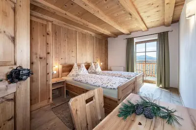 a bedroom with a bed in a room with a window at Platzbon in Bressanone