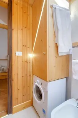a bedroom with two bunk beds in a room at Appartamento Saslonch 21 in Moena