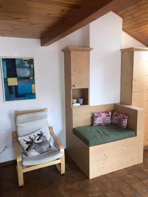 a bathroom with a shower and a toilet and a sink at Appartamento Saslonch 21 in Moena