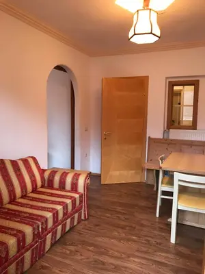 a living room with a couch and a table at Biohof Niedereben in Rablà
