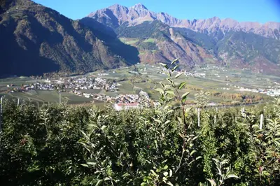 a town in a valley with mountains in the background at Biohof Niedereben in Rablà
