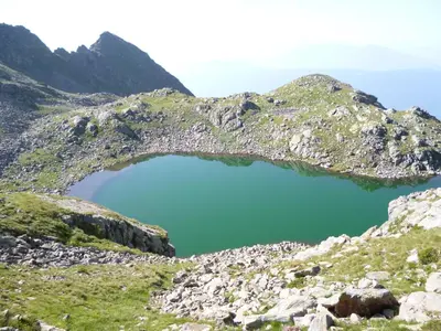 a view of a blue lake on a mountain at Appartements Schusterhof in Naz-Sciaves
