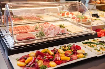 a buffet filled with lots of different types of food at Hotel Garni Sirmian in Merano