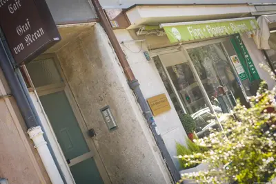an entrance to a building with a green door at Apartment Merano in Merano