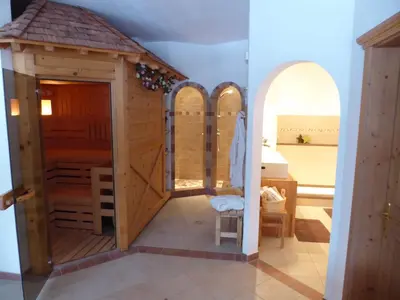 a living room with a couch and a table at Sonnhof in Trodena