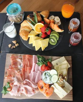 a tray of different types of food on a table at Ban Rutzner in SantʼAndrea in Monte