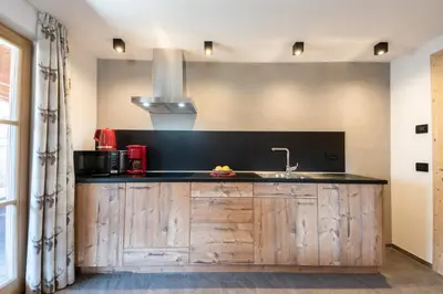 a kitchen with a sink and a counter top at Agriturismo Lüch de Vanc in San Martino in Badia