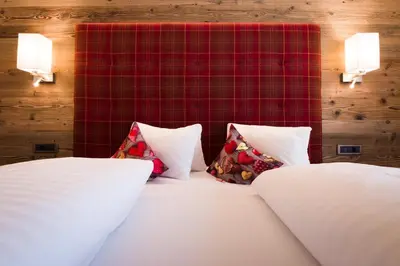 a bedroom with two pillows on a bed at Hotel Garni Vigilhof in Lana