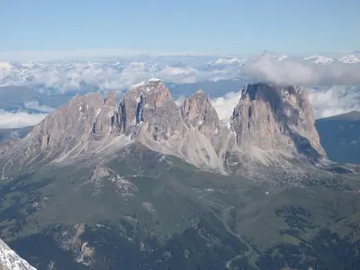 a view of a mountain with clouds in the background at Tinahof in Selva di Val Gardena