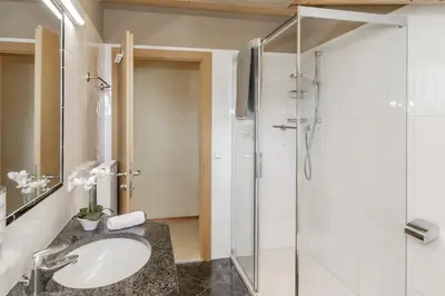 a bathroom with a sink and a shower at Apartment Wieser Eppan in Appiano sulla Strada del Vino