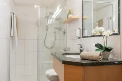 a bathroom with a toilet and a sink and a shower at Apartment Wieser Eppan in Appiano sulla Strada del Vino