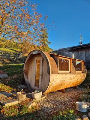 a small wooden boat sitting in front of a house at Salahaus in Verano