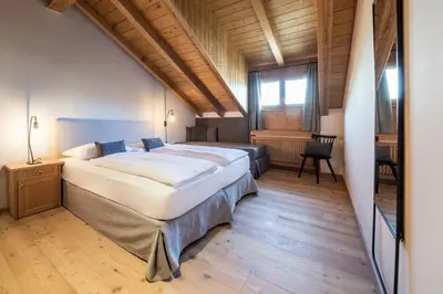 a bedroom with a large bed in a room at Landhaus Lina in Caldaro