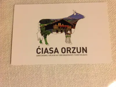 a sign with a picture of a cow with the words casa oruun at Ciasa Orzun in San Vigilio Di Marebbe