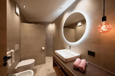 a bathroom with a sink and a mirror at B&B Aretia in Santa Cristina in Val Gardena