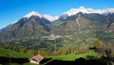 a view of a valley with snow covered mountains at Niederhof in Parcines