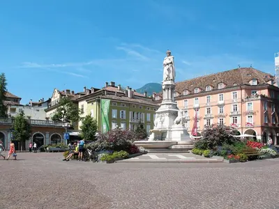 a statue in the middle of a square with a building at Apartment Pienzenau by Interhome in Postal