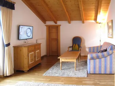 a living room with a couch and a table at Apartment Boymont by Interhome in Postal