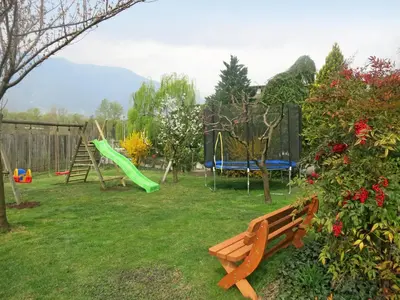 a park with a playground with a bench and a slide at Apartment Bellavista by Interhome in Postal