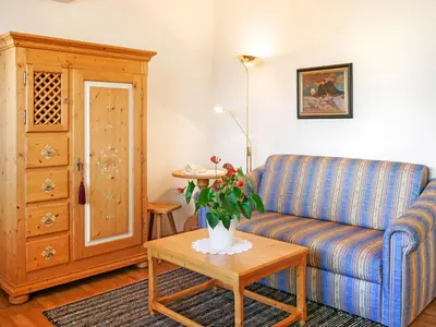 a living room with a couch and a table at Apartment Bellavista by Interhome in Postal