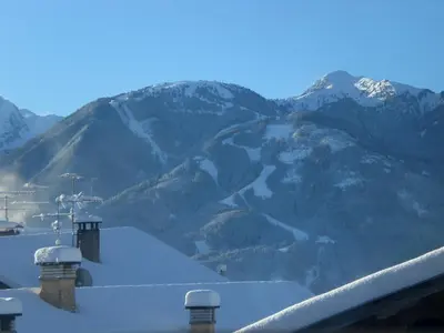 a view of a mountain range with snow covered mountains at Albergo Pensione Serenetta in Varena