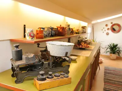 a kitchen counter with an old sewing machine on it at Haus Gilli in Lagundo