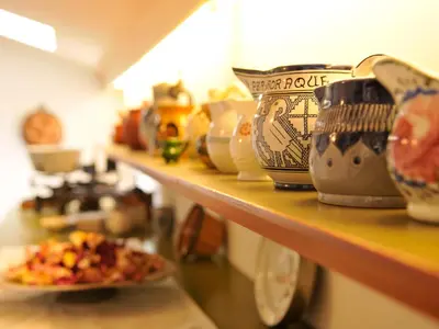 a counter with a plate of food on a shelf at Haus Gilli in Lagundo