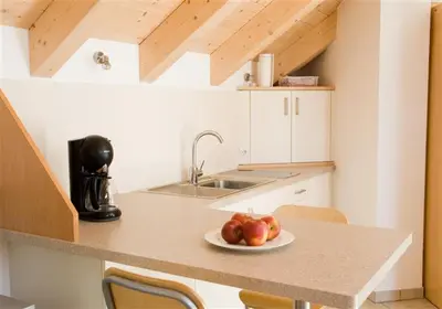 a plate of apples on a counter in a kitchen at Chalet Anna in Marlengo