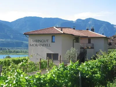 a building with a sign that reads went out moorfield at Weingut Morandell in Caldaro