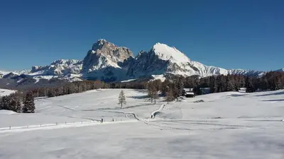 a snow covered mountain in front of a snow covered slope at Haus Bernard in Siusi