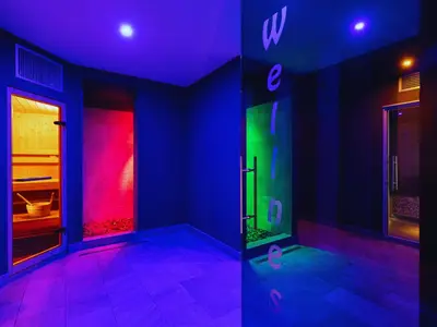 two pictures of a room with a bathroom with a shower at Hotel Orso Grigio in Selva di Cadore