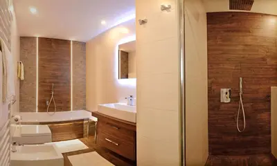 a bathroom with a toilet and a sink and a shower at Apartments Mujnei in Santa Cristina in Val Gardena
