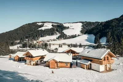 a ski lodge with snow on the ground at Pradel Dolomites in San Martino in Badia
