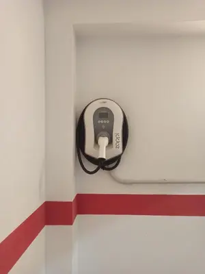 a charger is attached to a door in a room at Villa David Dolomites in Selva di Val Gardena